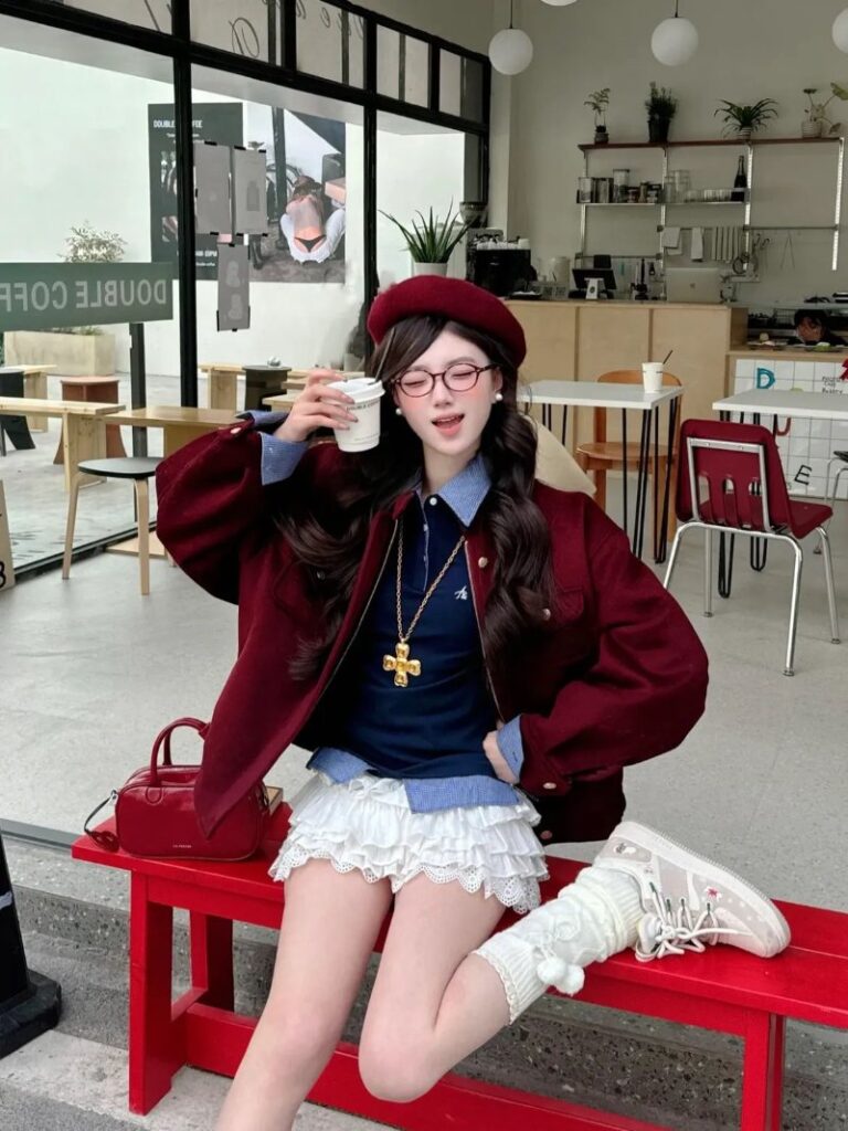 Hack tuổi cùng áo len mix sơ mi và chân váy