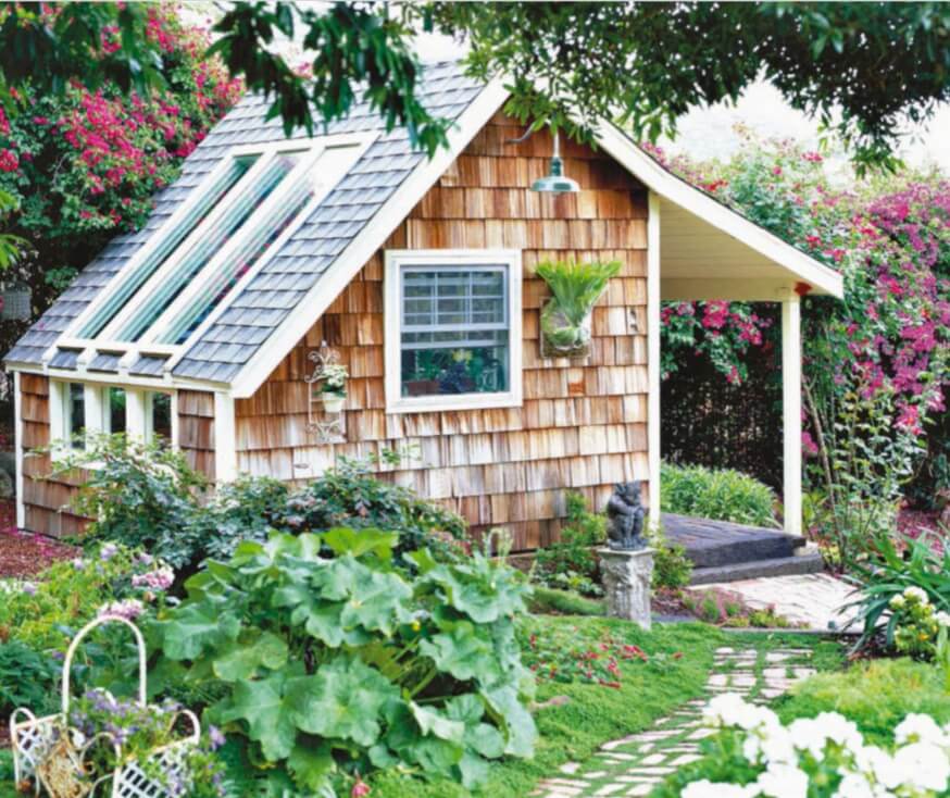  More than a greenhouse, more than a garden shed, this wood-shingled cottage provides play space and work space. South-facing solar windows bathe the cottage with light, and a front porch invites relaxation. 