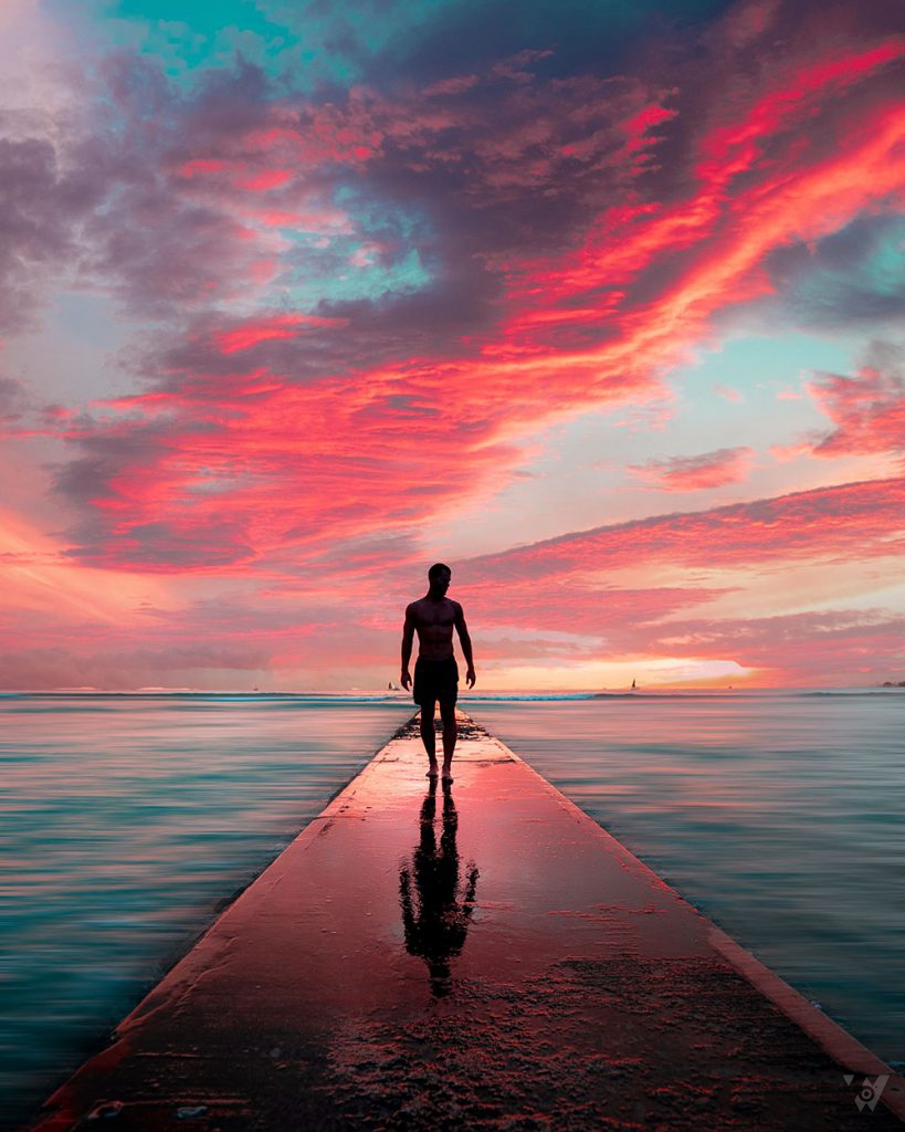 silhouette-male-walking-stone-pier-with-his-reflection-beautiful-breathtaking-clouds-819x1024-1
